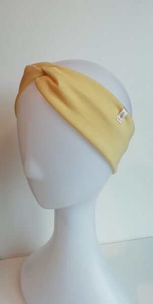 Gaiši dzeltena trikotāžas ausaine (80)